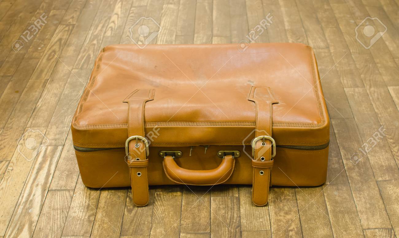 tan leather suitcase