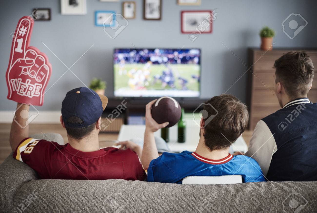 Three men with American football equipment - 70820608 Three men with American football equipment - 70820608