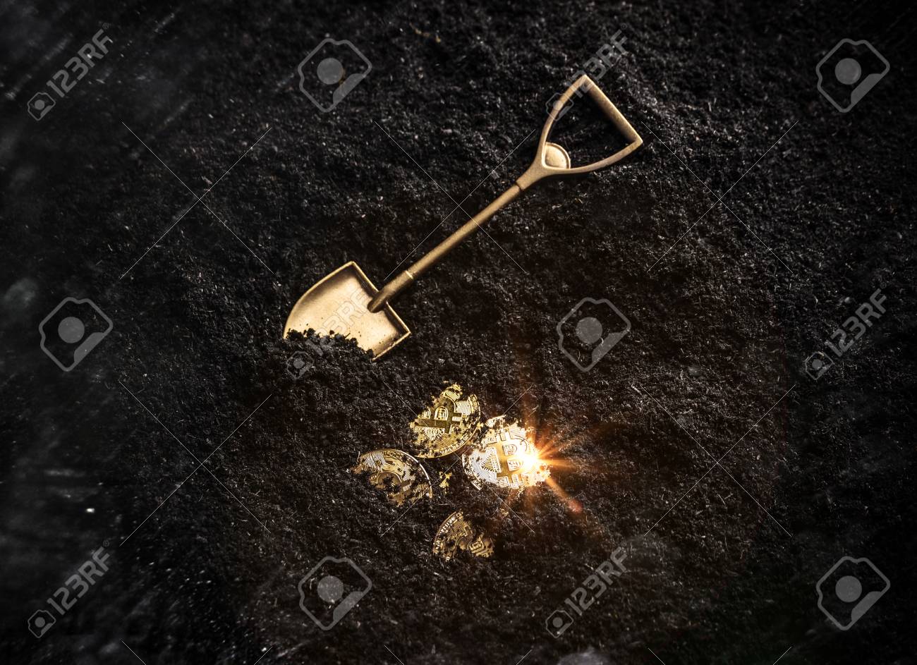 Bitcoin gold coins and shovel gardening tool. Virtual cryptocurrency mining concept. - 104374978 Bitcoin gold coins and shovel gardening tool. Virtual cryptocurrency mining concept. - 104374978