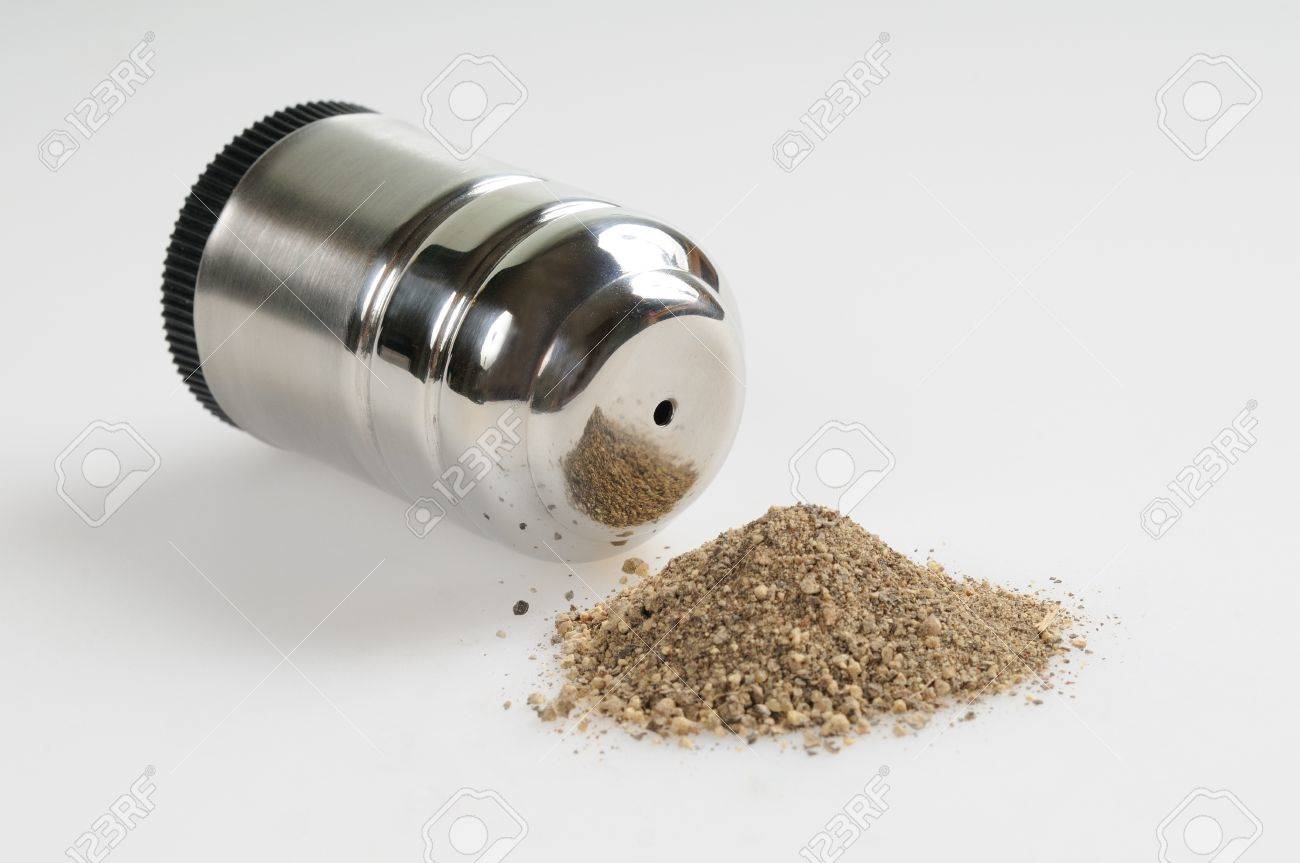 Pepper Shaker Grey Background And Spilled Pepper Stock Photo - Pepper Shaker Grey Background And Spilled Pepper Stock Photo pepper shaker grey background and spilled pepper stock photo - pepper shaker grey background and spilled pepper stock photo