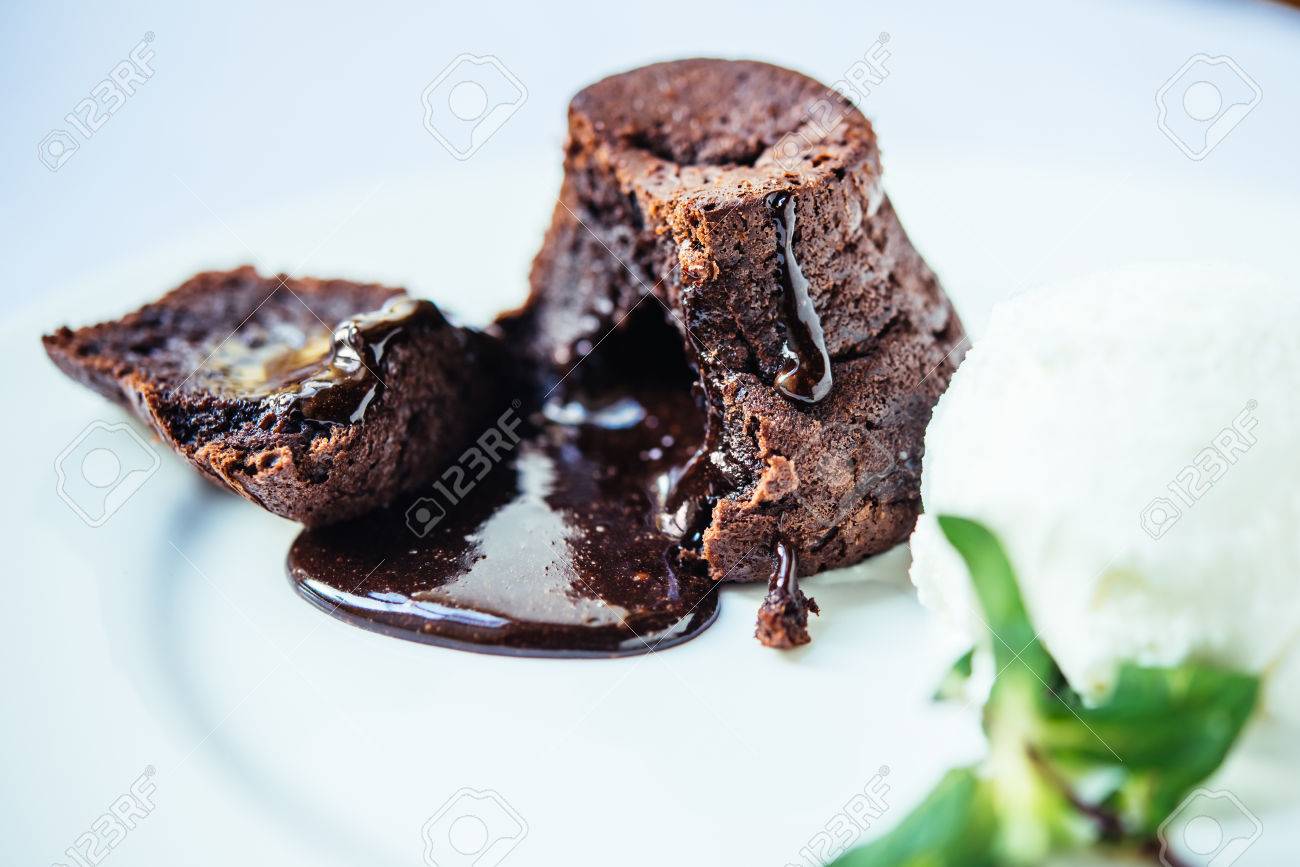 Molten chocolate lava cake or Fondant on white plate - 54425207 Molten chocolate lava cake or Fondant on white plate - 54425207