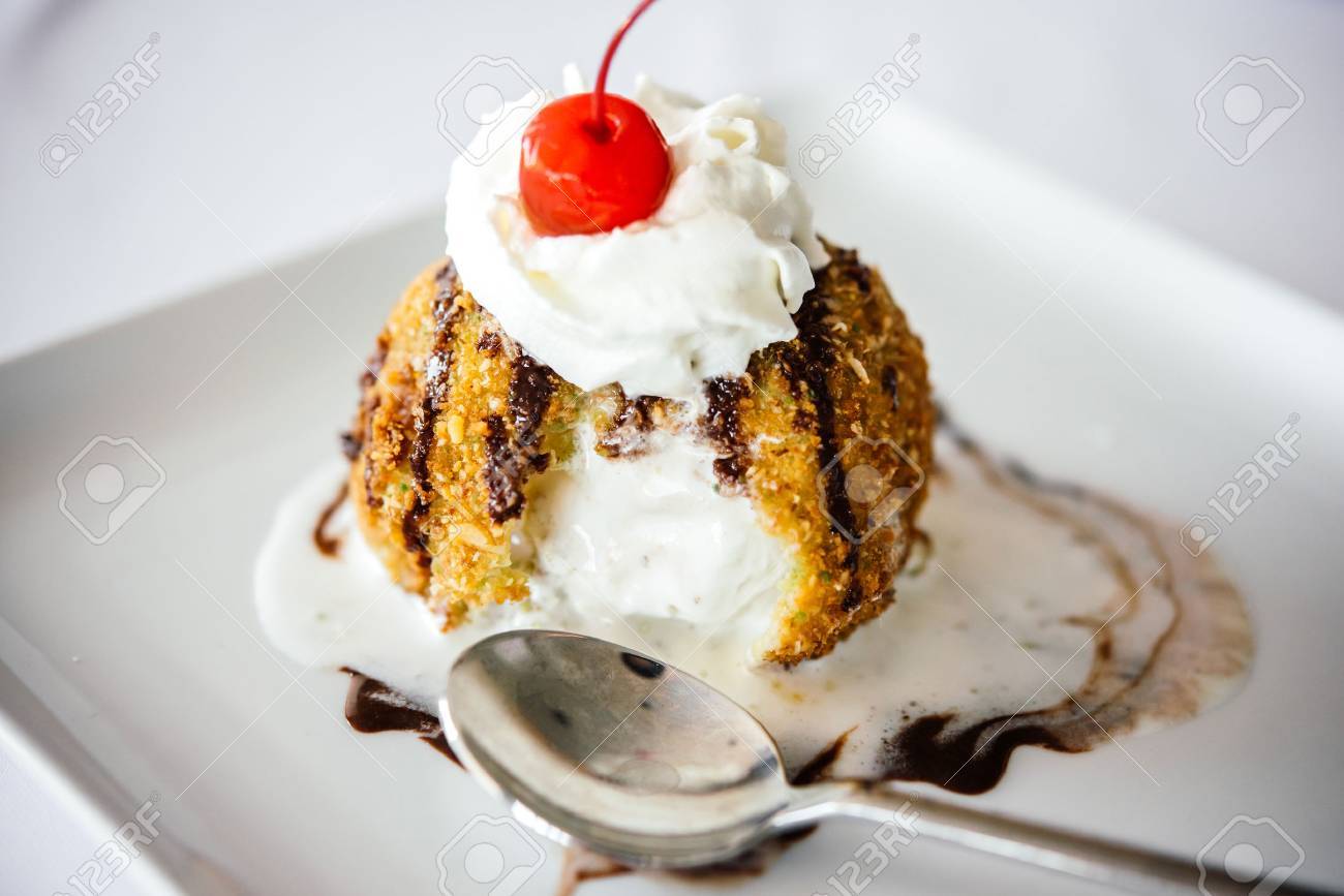 Fried ice cream served on white plate - 61193773 Fried ice cream served on white plate - 61193773
