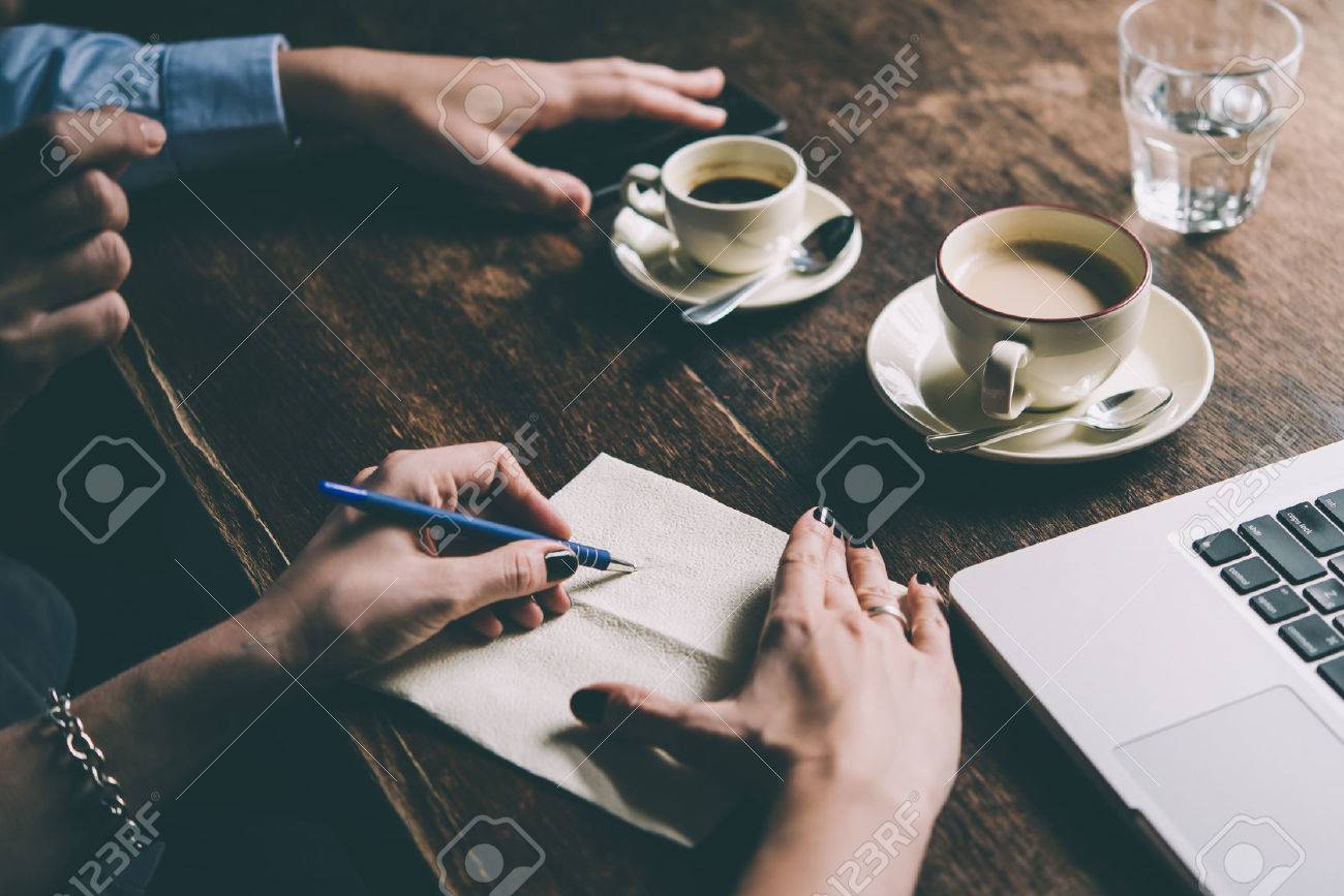 Two women discussing business projects in a cafe while having coffee. Startup, ideas and brain storm concept. Toned picture - 73064275 Two women discussing business projects in a cafe while having coffee. Startup, ideas and brain storm concept. Toned picture - 73064275