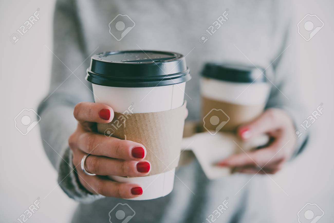 Two take-away cupsof coffee in hands. Toned image - 87845304 Two take-away cupsof coffee in hands. Toned image - 87845304