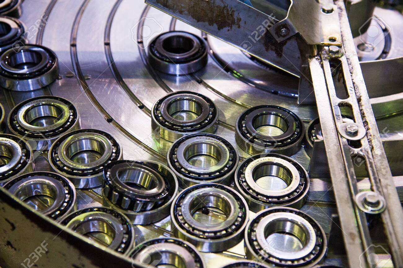 https://previews.123rf.com/images/grigorenko/grigorenko2001/grigorenko200100133/139126764-production-of-bearings-steel-factory-production-line-of-the-machine.jpg