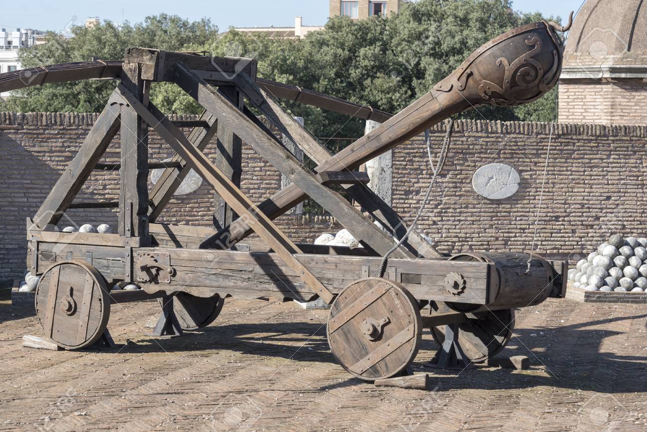 A Wooden Ballistic Device Of A Medieval Catapult. Ancient Military  Equipment In The Castle Of St. Angel In Rome. Stock Photo, Picture and  Royalty Free Image. Image 113481394.