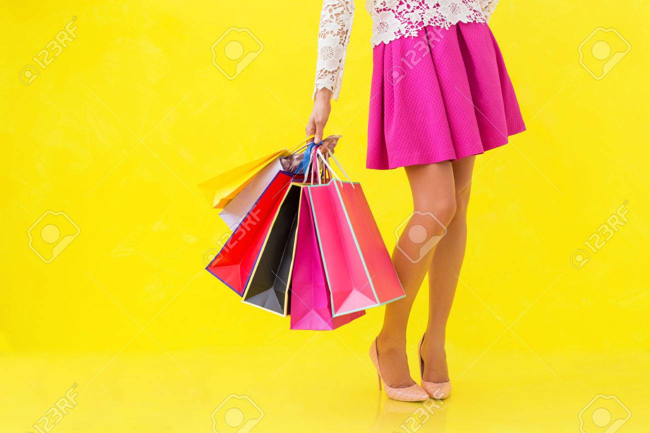 Woman holding many shopping bags - 60165952 Woman holding many shopping bags - 60165952