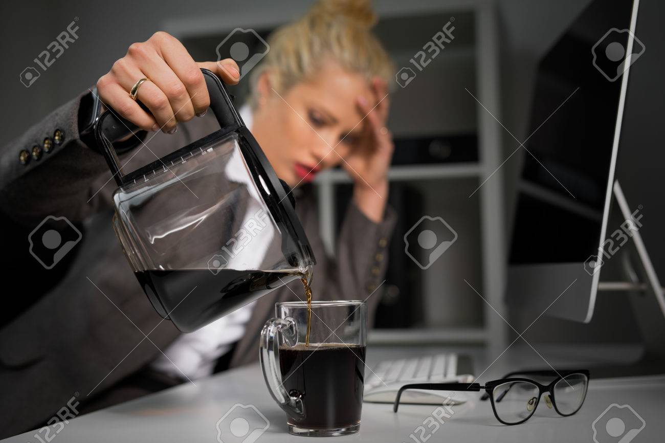 Woman pouring coffee in cup - 74114587 Woman pouring coffee in cup - 74114587