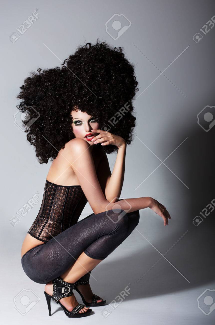 Updo Beautiful Woman In Dark Curly Fantastic Wig Sitting Frizzy
