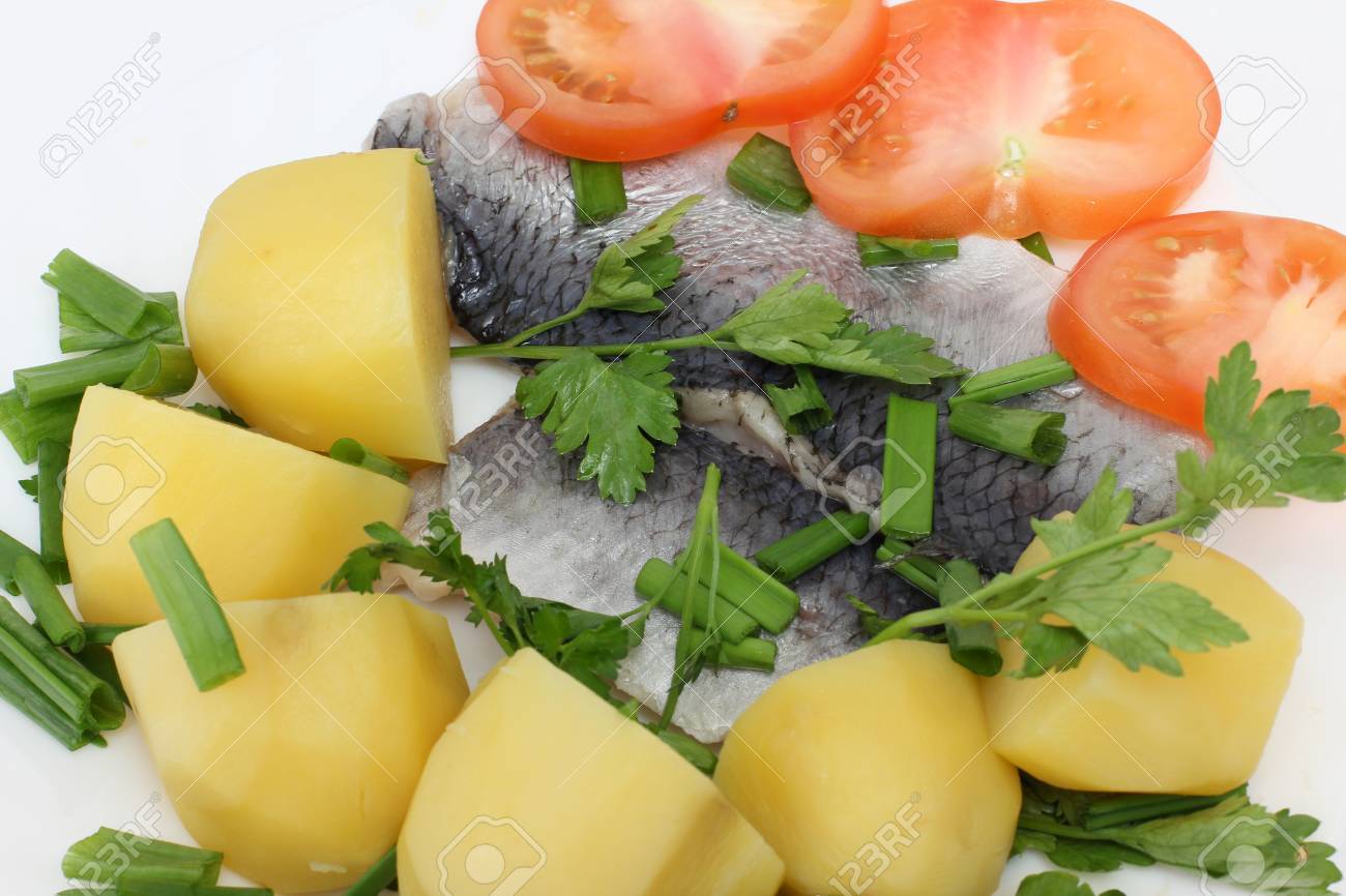 color photographs of salt herring and potatoes on a plate stock photo 13318435