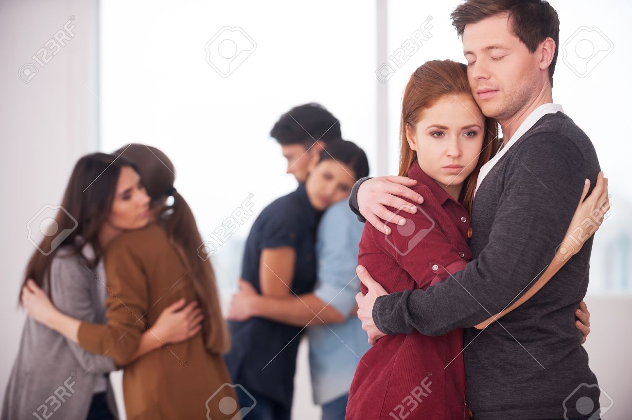 people we can trust group of depressed people hugging each other