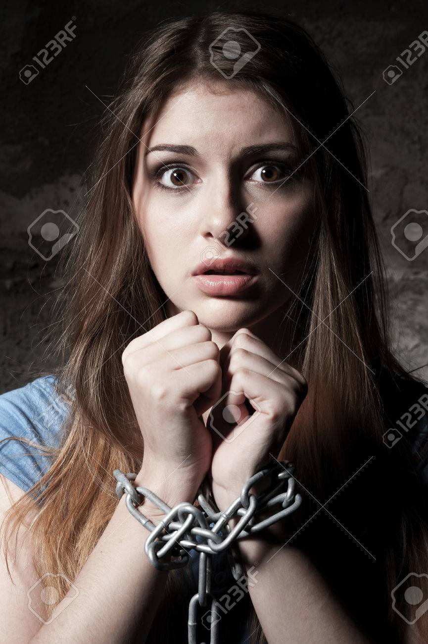 Woman Trapped In Chains. Photography Symbolizing Captivity Or Violence  Against Woman. Stock Photo, Picture and Royalty Free Image. Image 146416623.