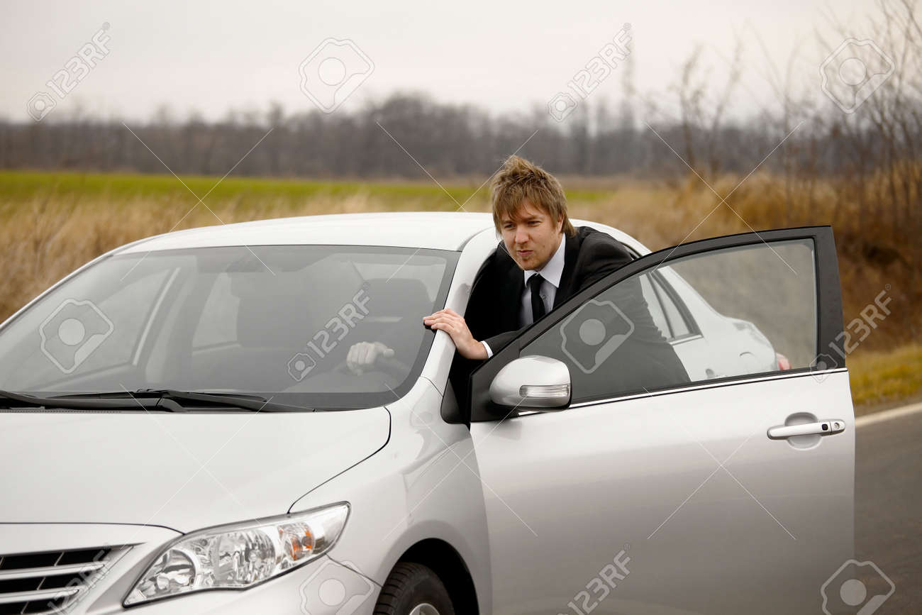 Pushing a broken down car - 23531878 Pushing a broken down car - 23531878