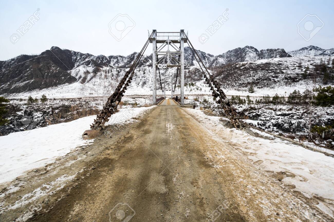 View of the bridge over river Katun in Altay mountains in the winter, Siberia, Russia - 146468111 View of the bridge over river Katun in Altay mountains in the winter, Siberia, Russia - 146468111