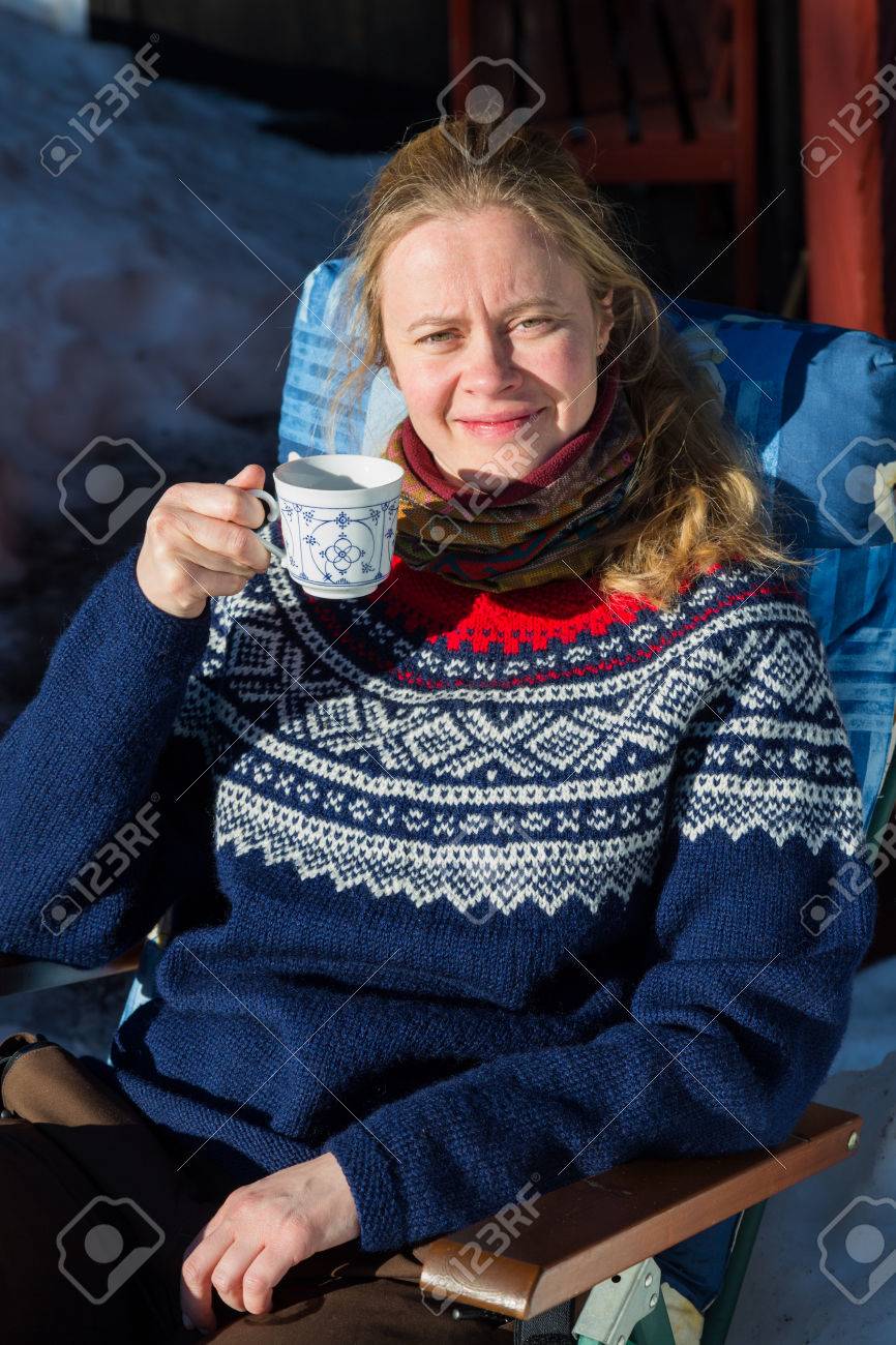 Close Up Of Young Pretty Norwegian Woman Enjoying Some Winter Sunshine And  A Cup Of Coffee In A Traditional Norwegian Jumper Stock Photo, Picture and  Royalty Free Image. Image 49555979.