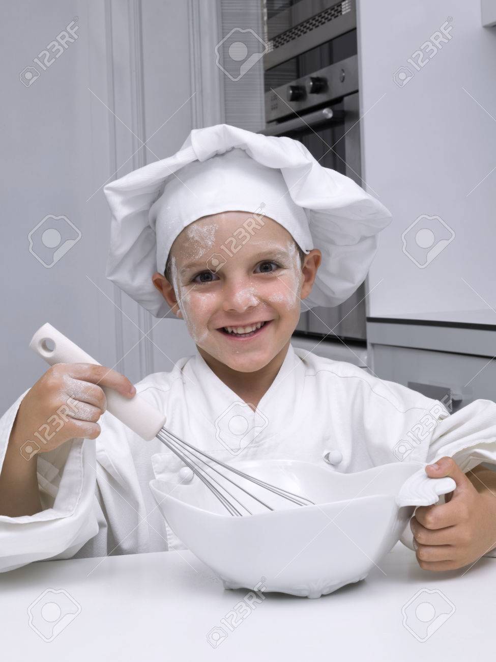 Children, dressed as a chef, with A beater in the hand - 38156224 Children, dressed as a chef, with A beater in the hand - 38156224