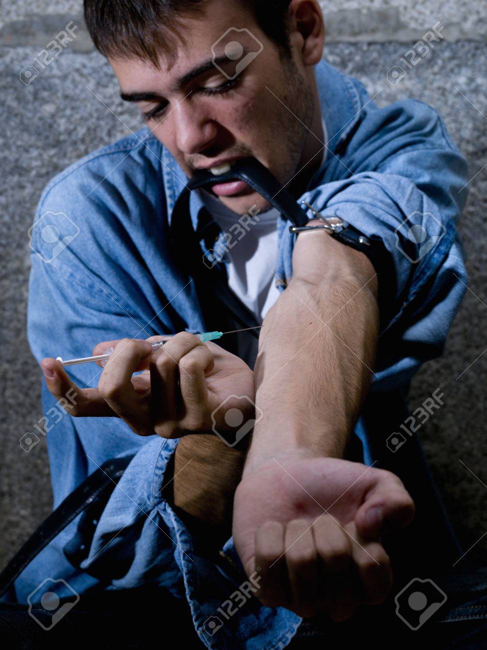 Young drug addict, drug being injected - 38156374 Young drug addict, drug being injected - 38156374