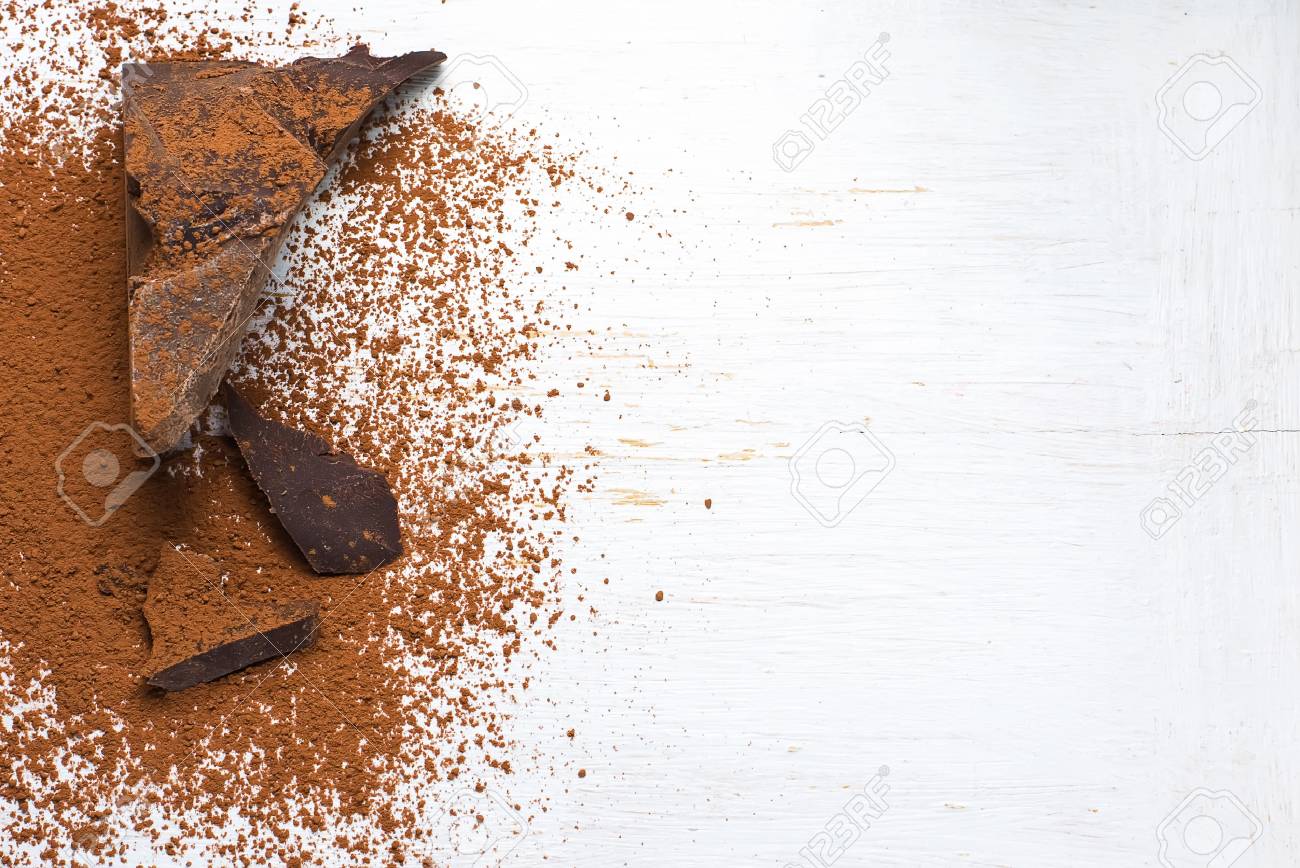 Chocolate ingredients: cocoa solids and cocoa powder. selective focus - 38683403 Chocolate ingredients: cocoa solids and cocoa powder. selective focus - 38683403