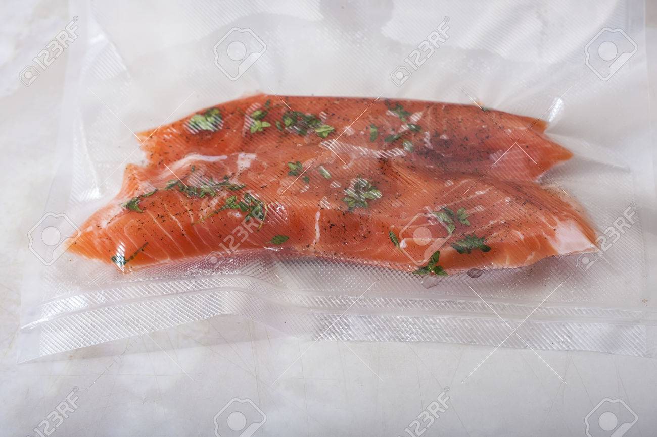 Salmon fillets in a vacuum package. Sous-vide, new technology cuisine - 51707055 Salmon fillets in a vacuum package. Sous-vide, new technology cuisine - 51707055