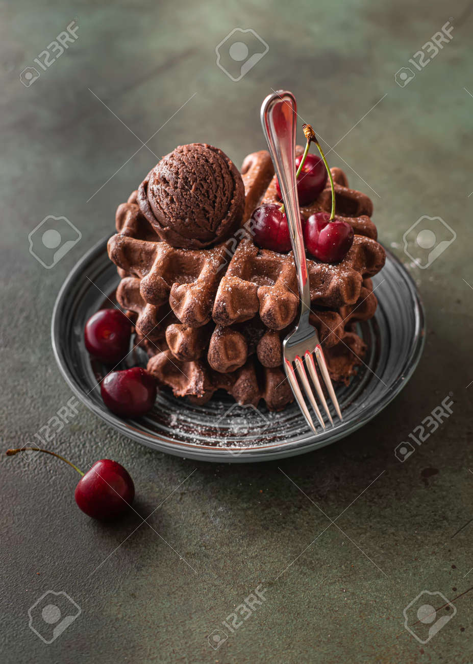 Homemade chocolate waffles with berries and chocolate ice cream. Delicious dessert or breakfast. Close-up - 171890469 Homemade chocolate waffles with berries and chocolate ice cream. Delicious dessert or breakfast. Close-up - 171890469