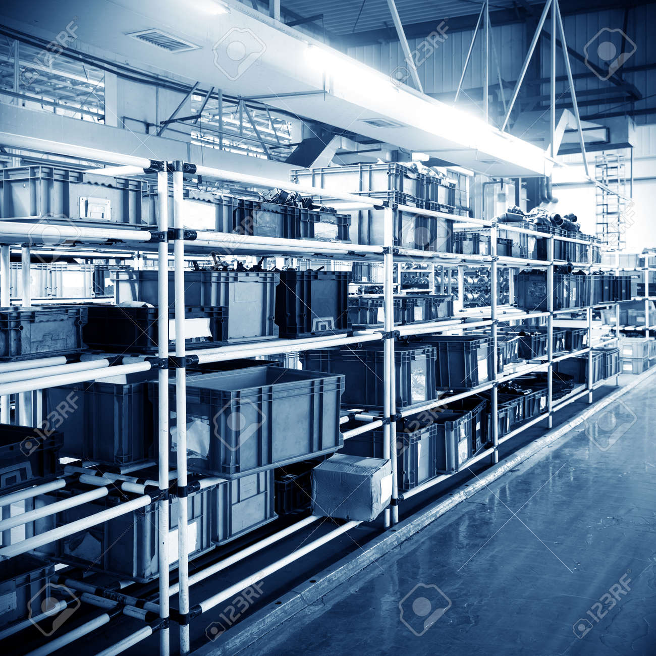 Factory warehouse shelves stocked with plastic containers. - 31890779 Factory warehouse shelves stocked with plastic containers. - 31890779