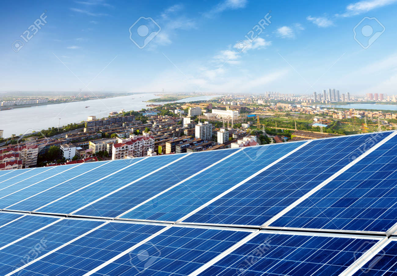 Aerial view of the city and the tower on top of the solar panel - 36092922 Aerial view of the city and the tower on top of the solar panel - 36092922