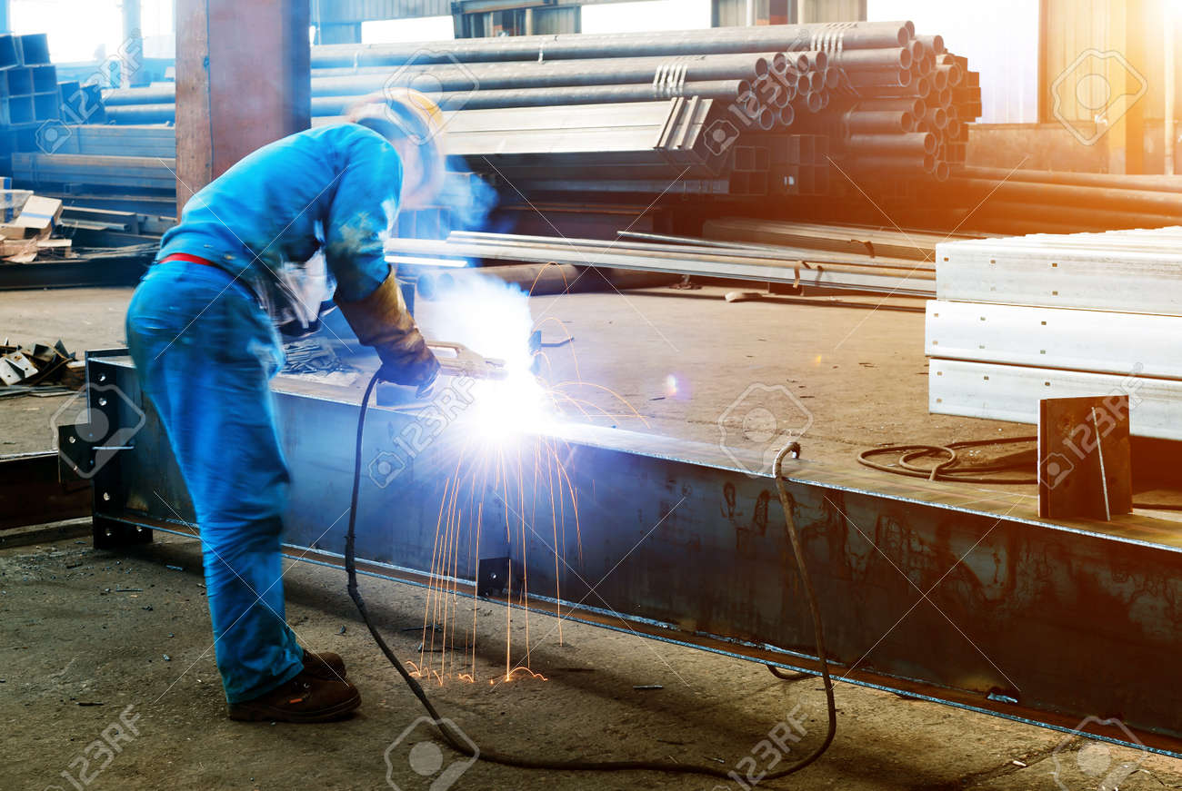 Workers at work, ongoing welding operation. - 54453326 Workers at work, ongoing welding operation. - 54453326