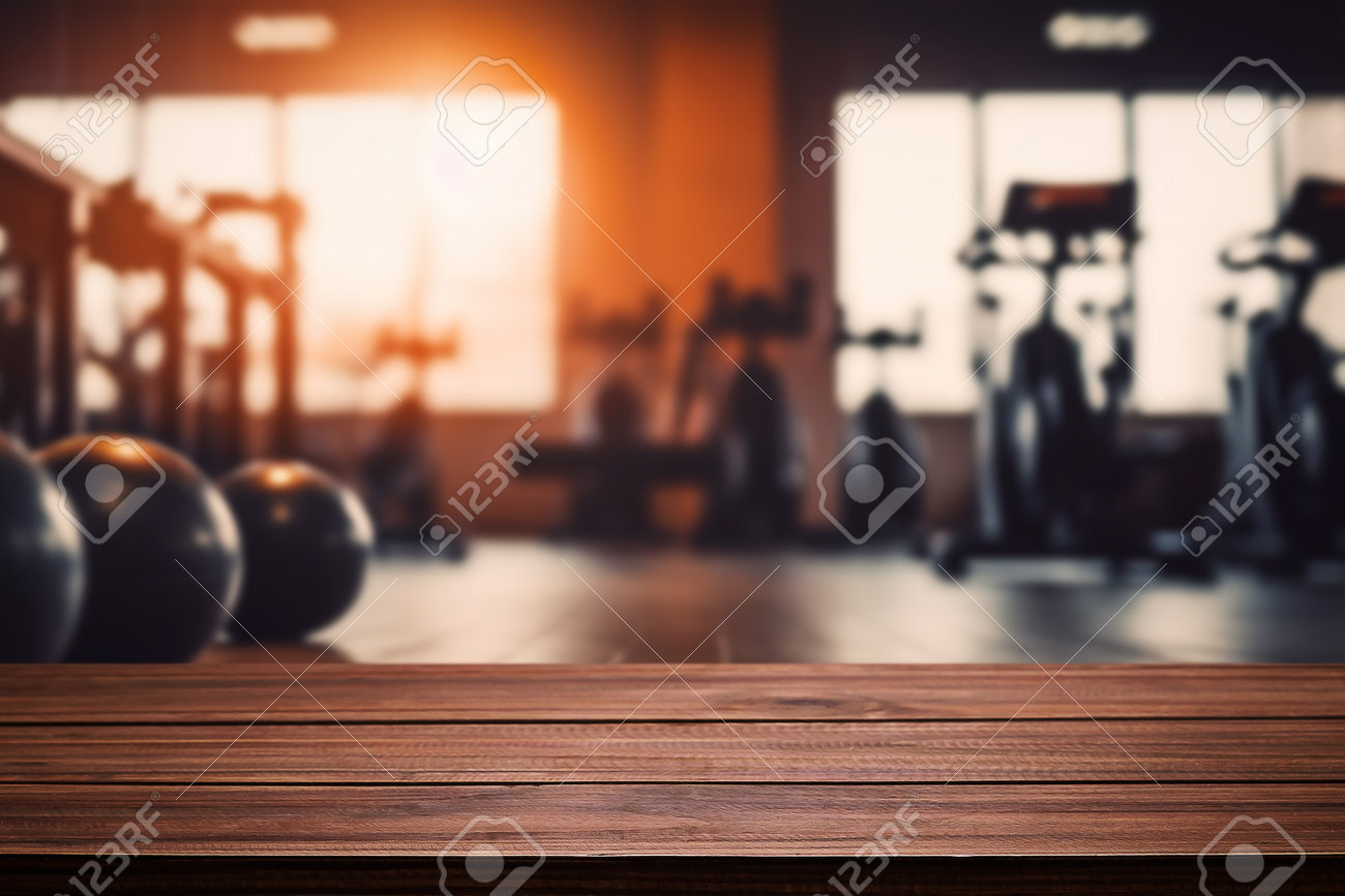 Blurred Background Of Fitness Gym And Wooden Table Free Space For Product  Display. Stock Photo, Picture and Royalty Free Image. Image 203025798., image size:1300x867