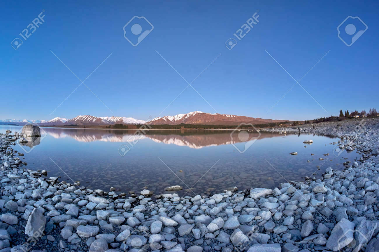 Fish Eye View Of Southern Alps And Its Reflection From Lake Tekapo New Stock Photo Picture And Royalty Free Image Image