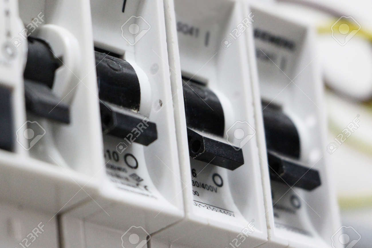 Closeup view of a set of electrical switches or trip switches on a circuit board - 22109120 Closeup view of a set of electrical switches or trip switches on a circuit board - 22109120