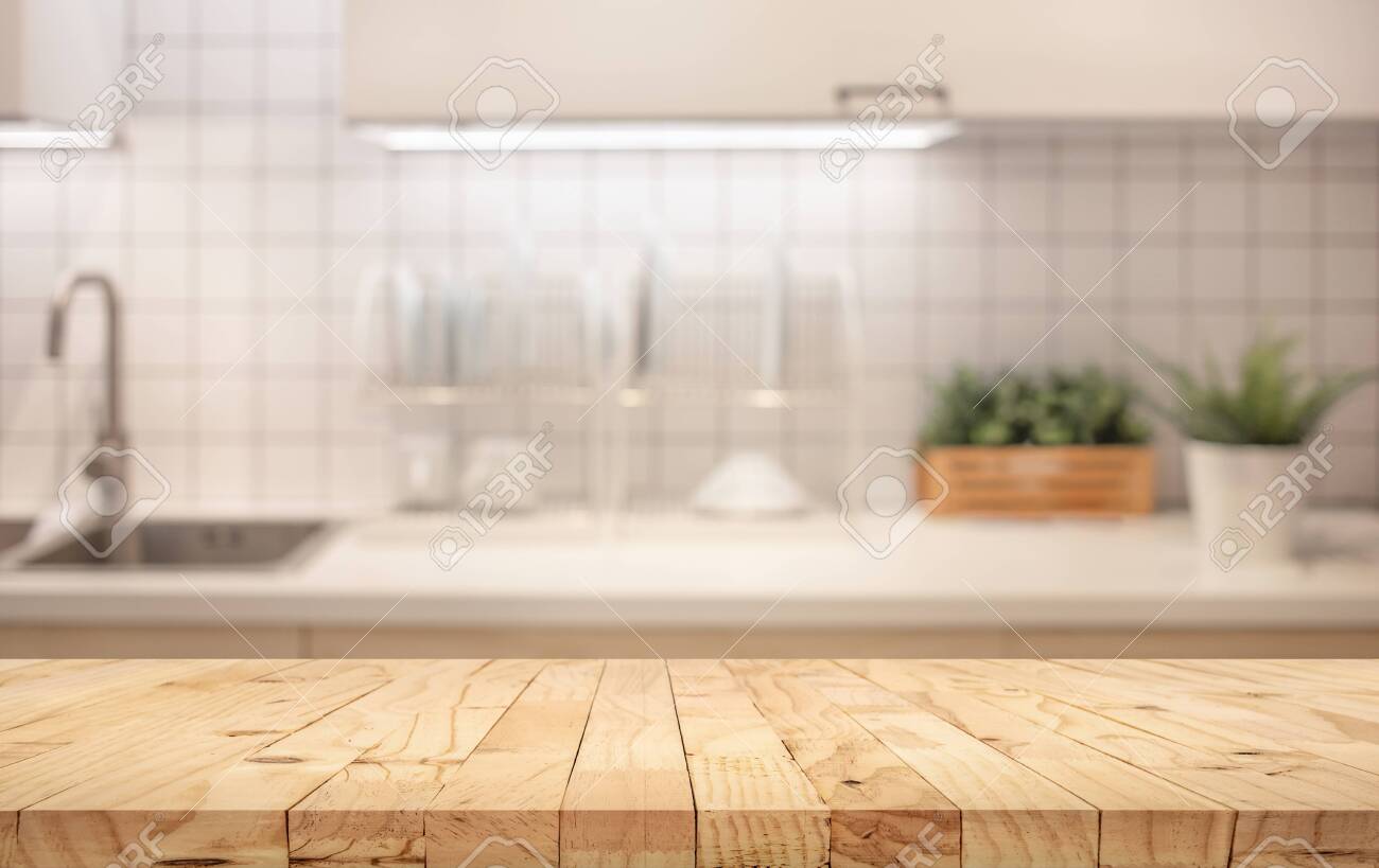 Wood Table Top On Blur Kitchen Counter Room Background For Montage Stock Photo Picture And Royalty Free Image Image 128093305