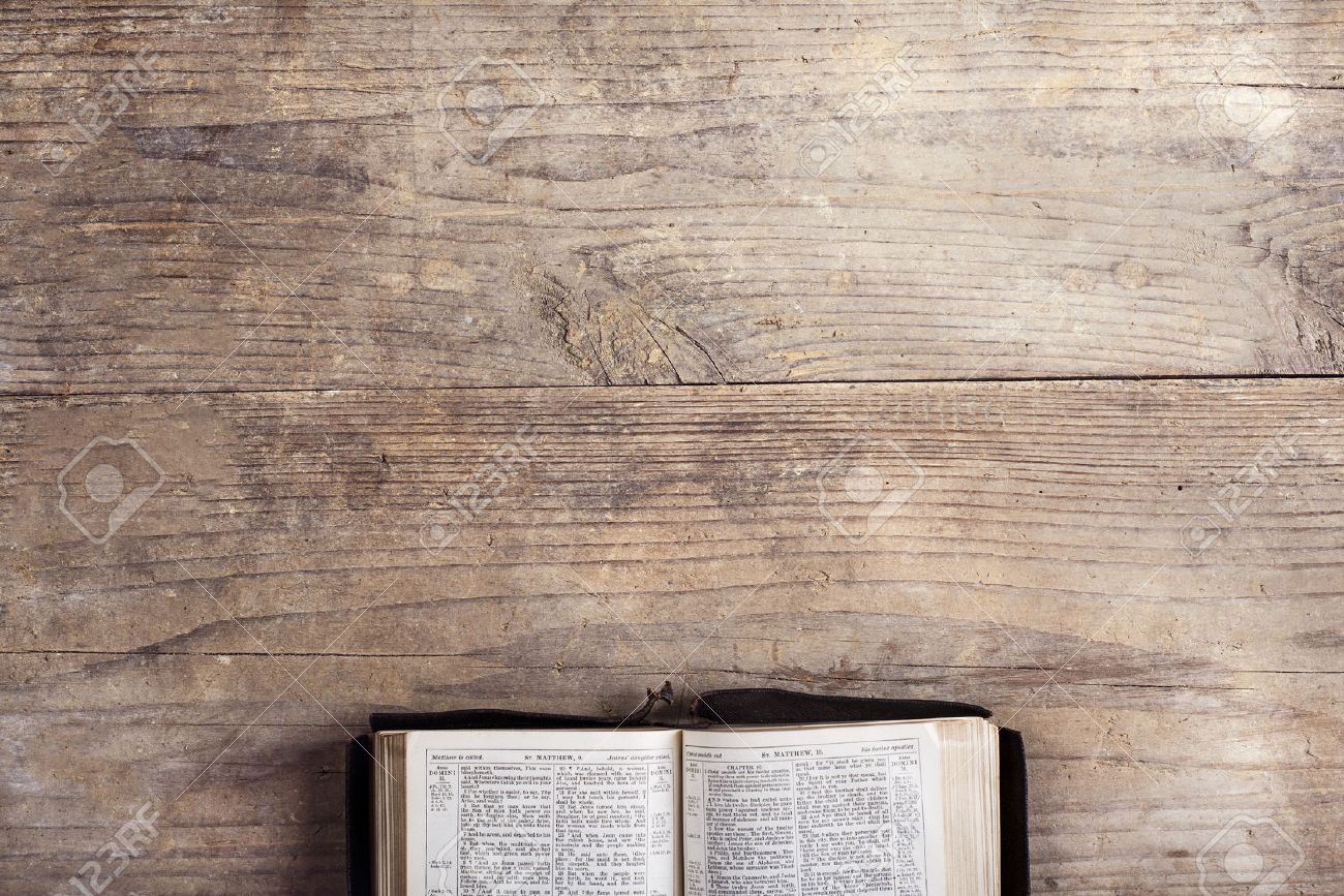 Opened Bible On A Wooden Desk Background. Stock Photo, Picture And Royalty  Free Image. Image 37086047.