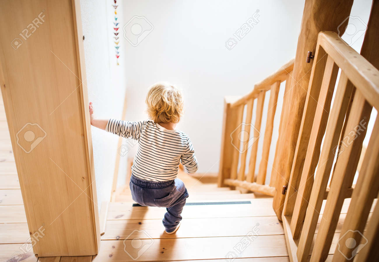 Toddler Boy In Dangerous Situation At Home Child Safety Concept - 