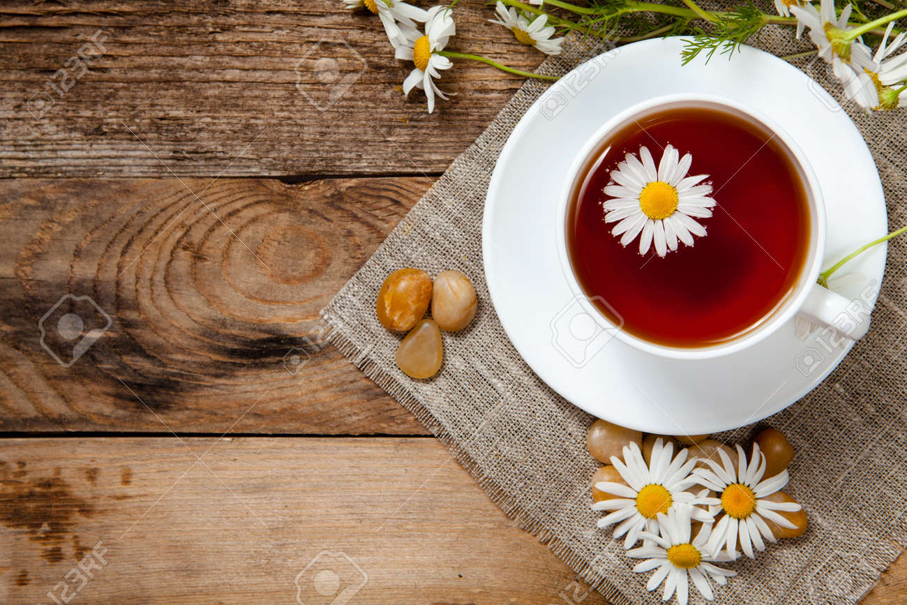 herbal tea with chamomile on old wooden table. Top view. - 29489811 herbal tea with chamomile on old wooden table. Top view. - 29489811