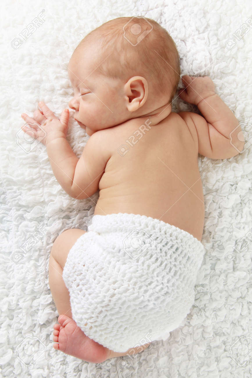 newborn baby boy sleeping wearing a knitted diaper cover stock baby boy cover photos