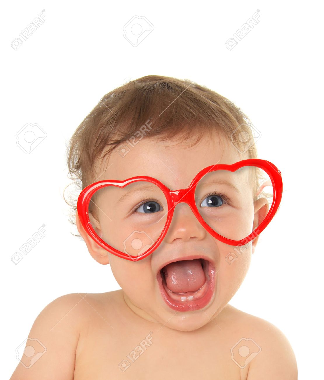 Ten month old baby boy wearing heart shape valentine glasses. - 50740500 Ten month old baby boy wearing heart shape valentine glasses. - 50740500