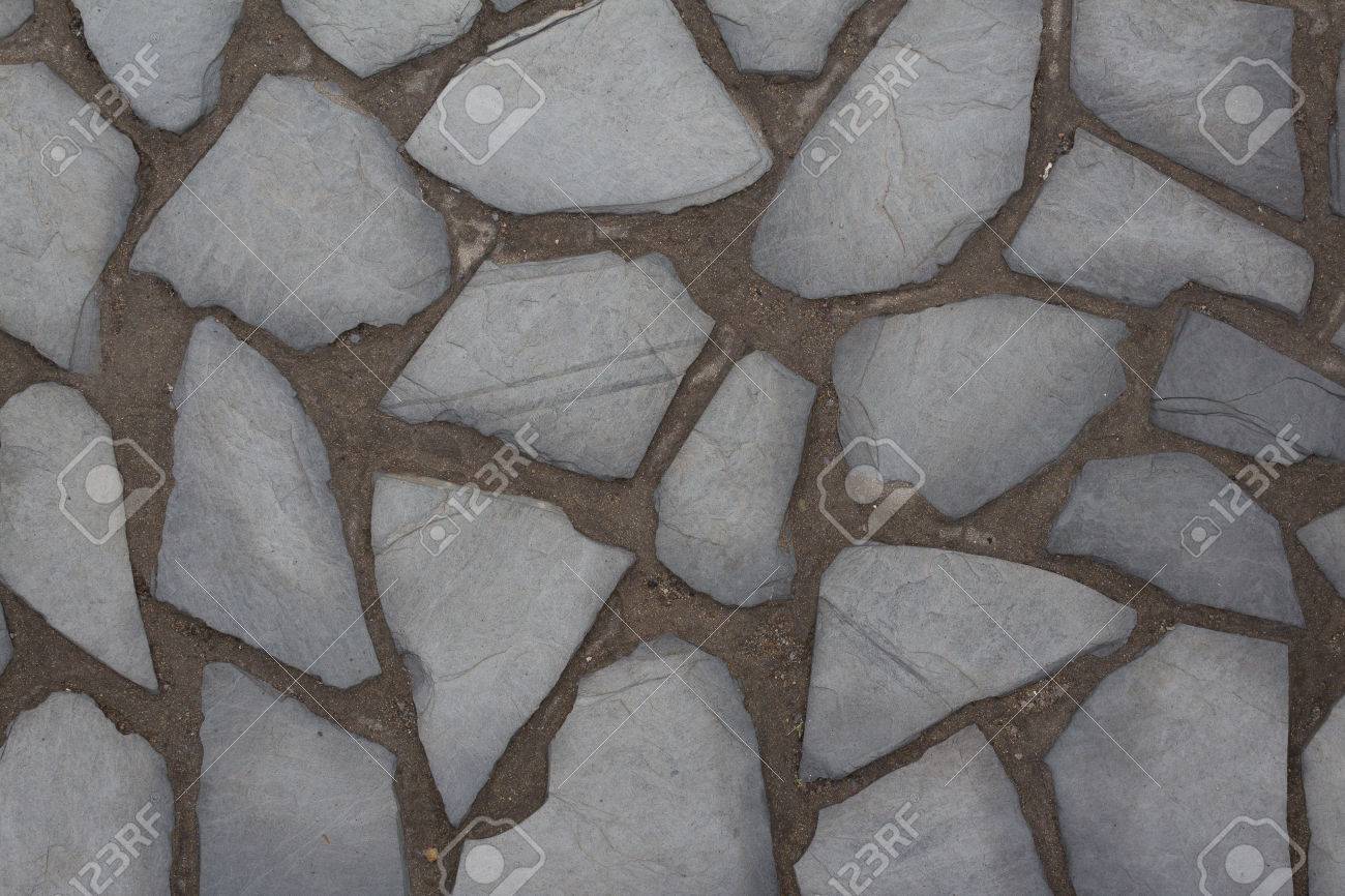 Mur de pierre naturelle de fond en pierre sol pavé Mur de pierre naturelle de fond en pierre sol pavé