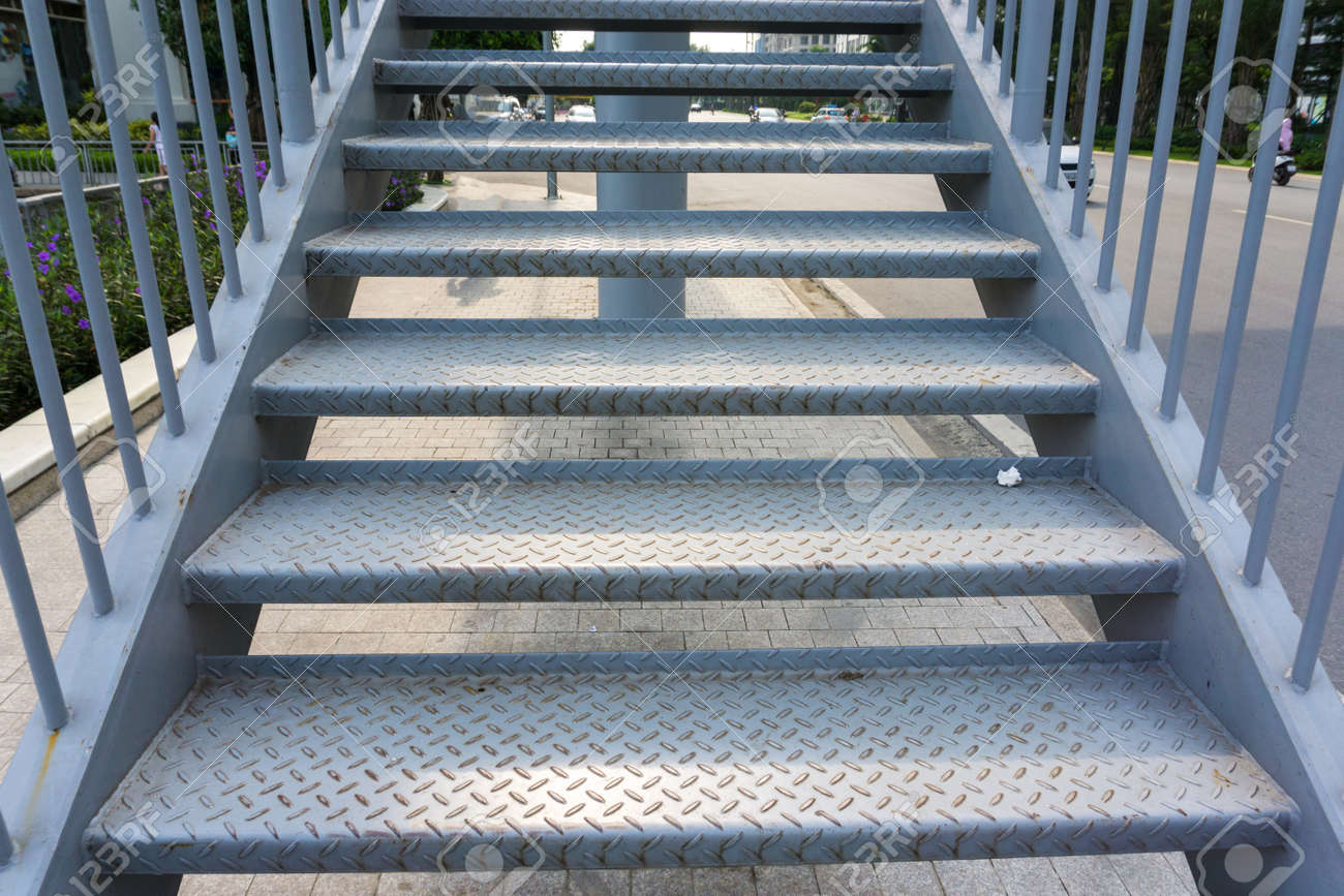 Steel stair step to walk up or walk down to the outdoor public bridge - 121049828 Steel stair step to walk up or walk down to the outdoor public bridge - 121049828