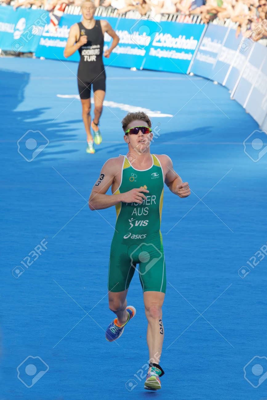 STOCKHOLM - AUG 23, 2015: Running Triathlete Ryan Fisher Chased By Jonas  Schomburg At The Finish At