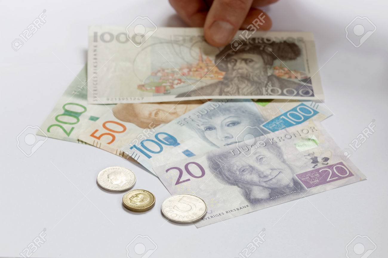 Swedish Currency 1, 5, 10, 20, 50, 100, 200 And 1000 SEK, New Layout 2016  Laying On A Table And A Hand Stock Photo, Picture and Royalty Free Image.  Image 64185299.