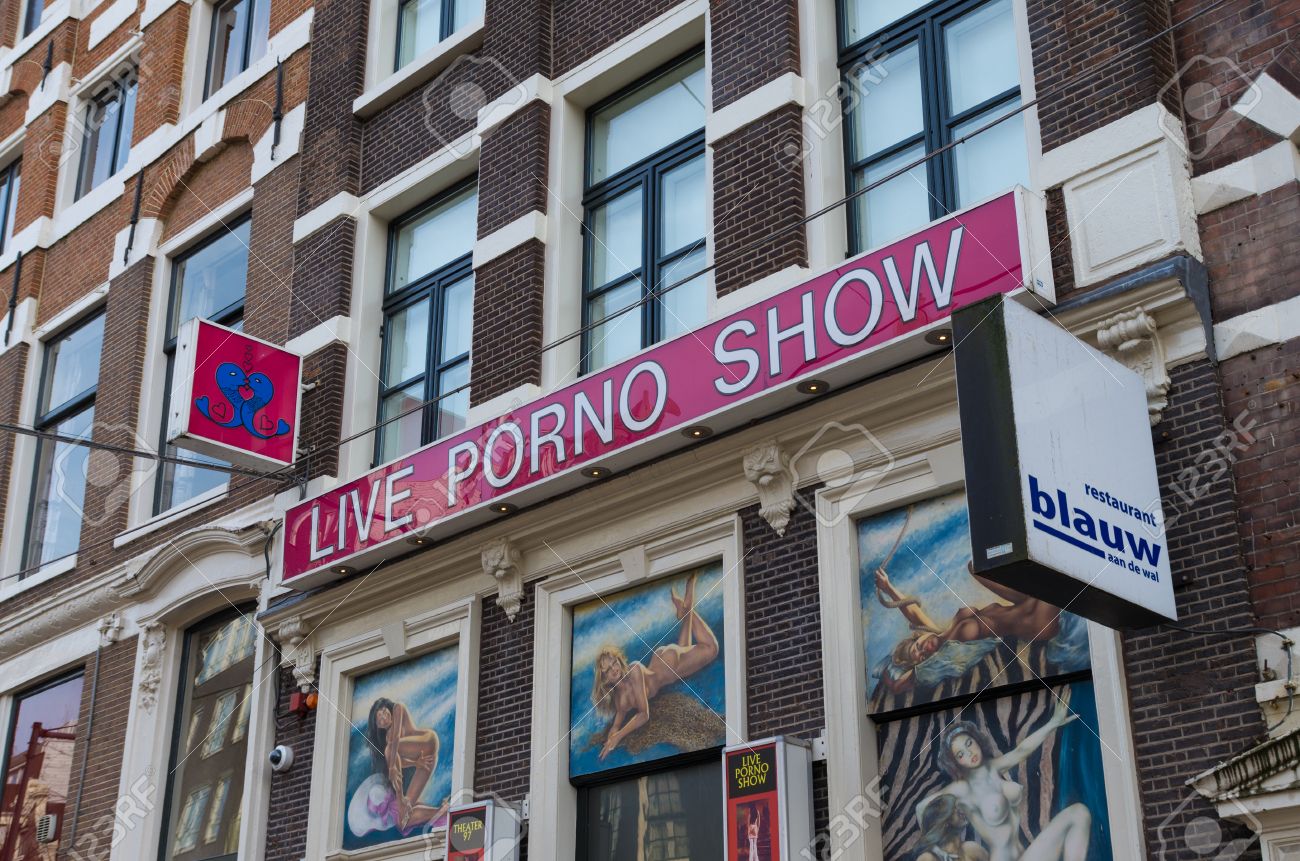 Exterior Of An Amsterdam Porno Show In The Red Light District. Prostitution  Has Been Legal In The Netherlands Since 2000. Before Then, Prostitution Was  Technically Illegal Although It Was Tolerated. Stock Photo,