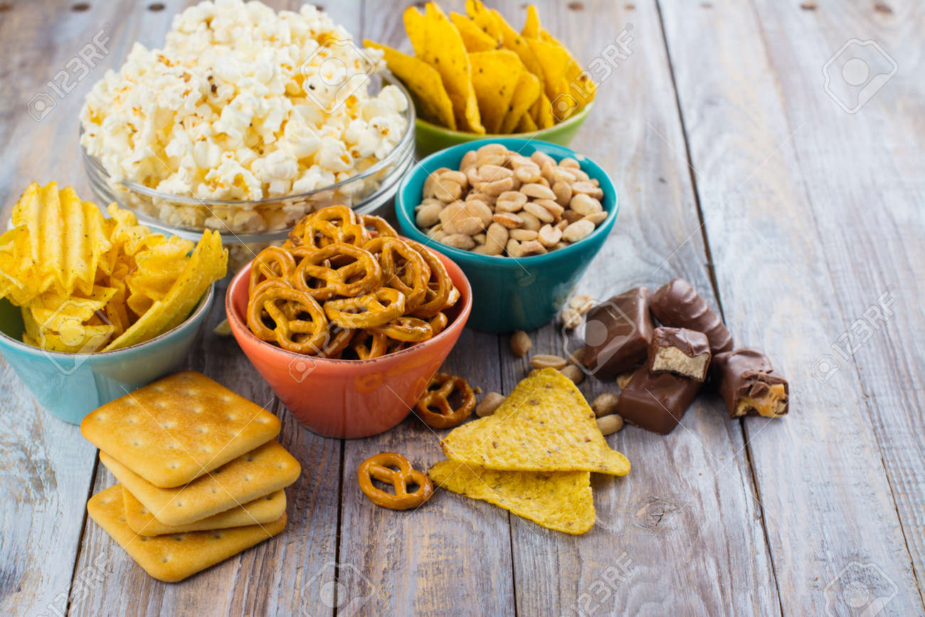 Assortment of unhealthy snacks. Diet or weight control concept. Space for text - 77354356 Assortment of unhealthy snacks. Diet or weight control concept. Space for text - 77354356