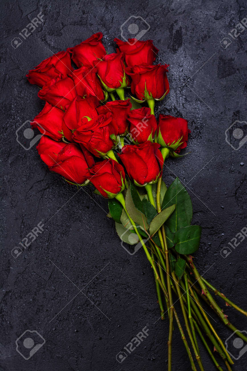 Bunch Of Red Roses On Black Stone Background Copy Space Stock