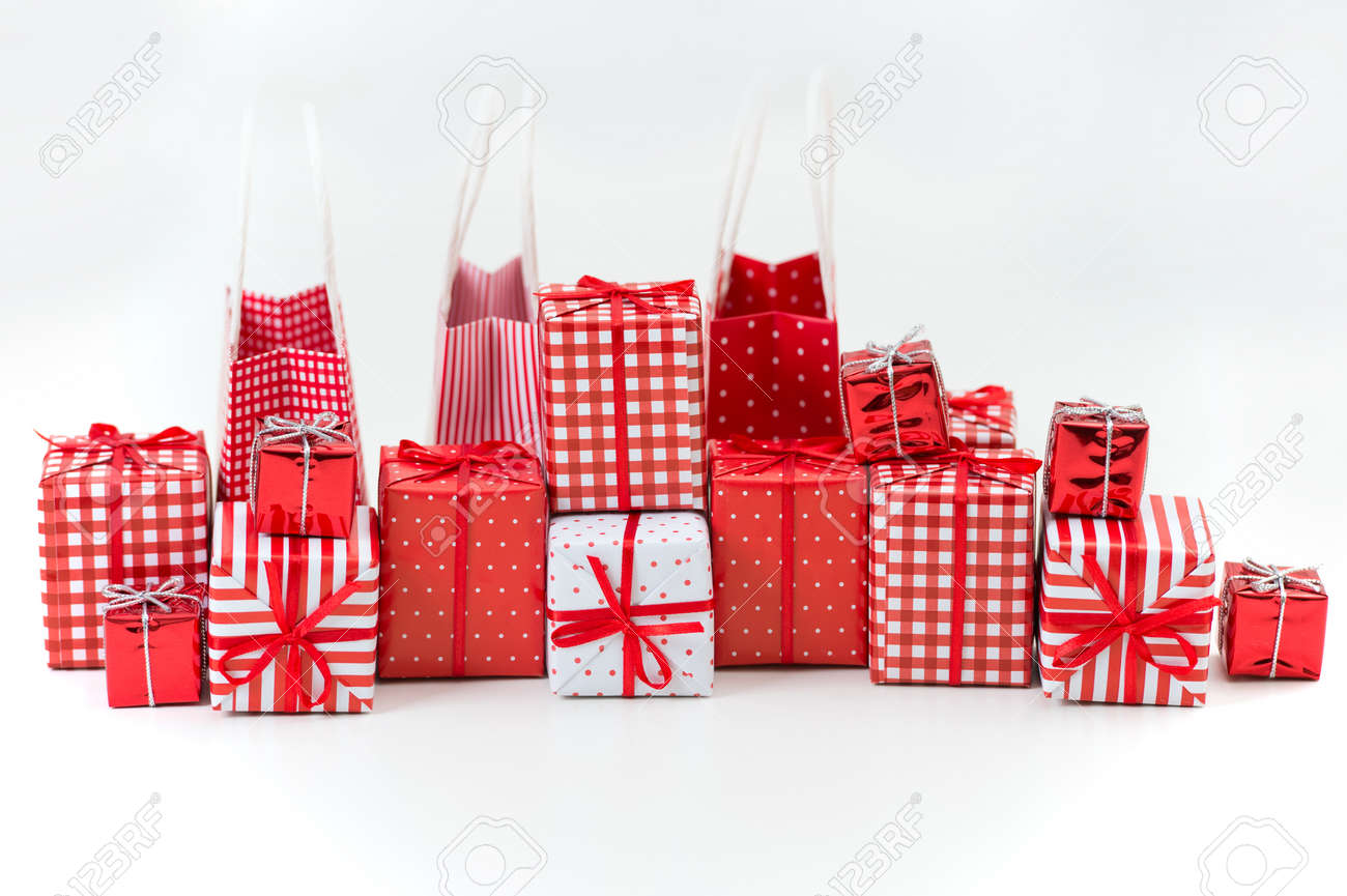 gift boxes with xmas presents wrapped in red paper with ornament on white background stock photo - Xmas Presents gift boxes with xmas presents wrapped in red paper with ornament on white background stock photo - Xmas Presents