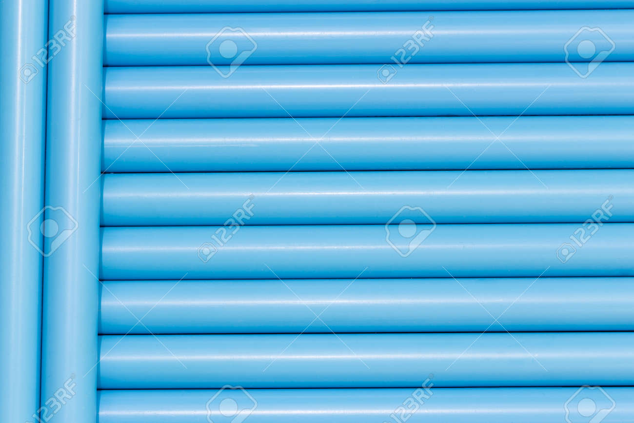 背景テクスチャのためのラインで青い塩ビ管 の写真素材 画像素材 Image