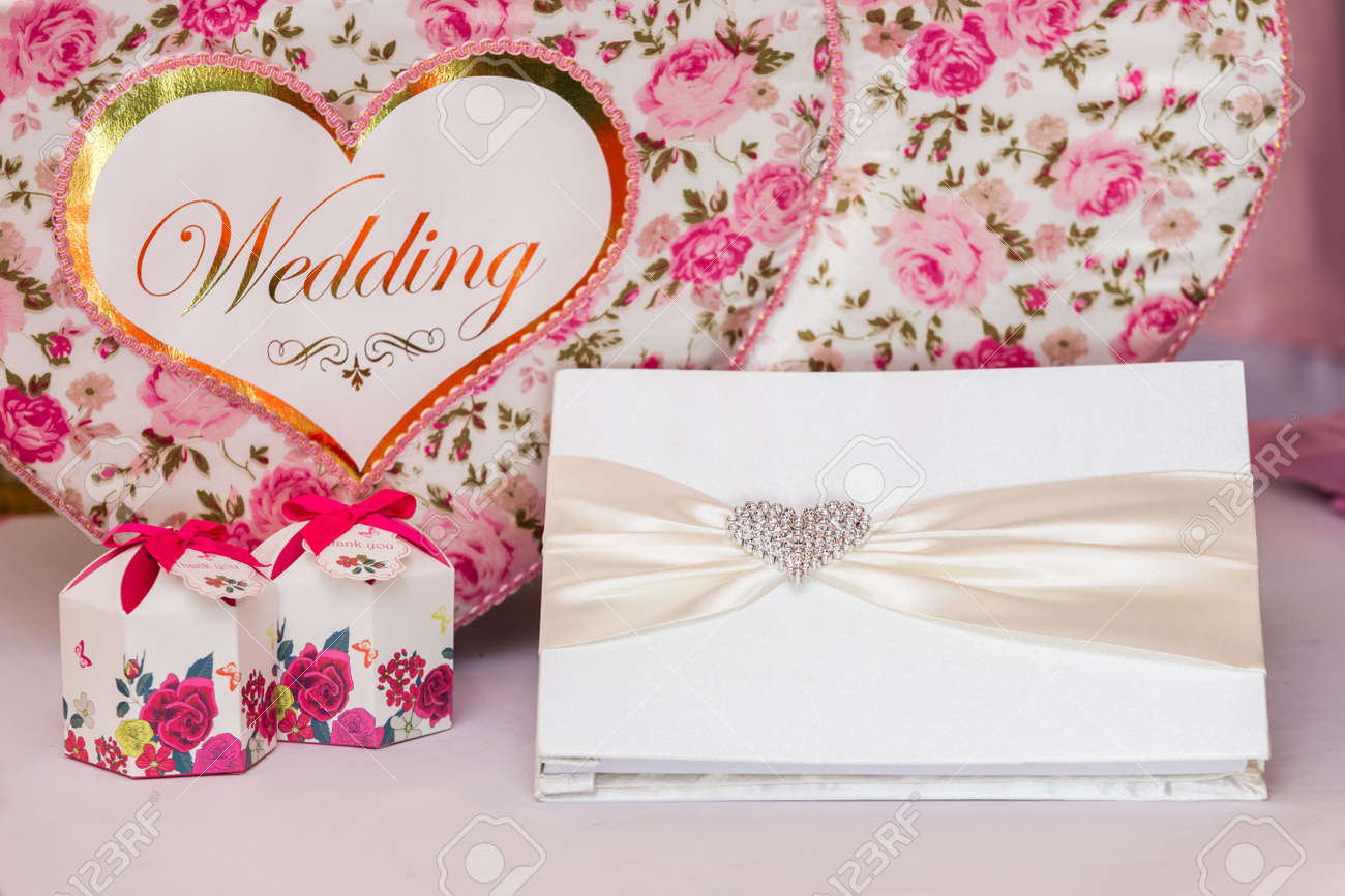 wedding guest book and wedding box on pink silk stock photo picture pink wedding guest books