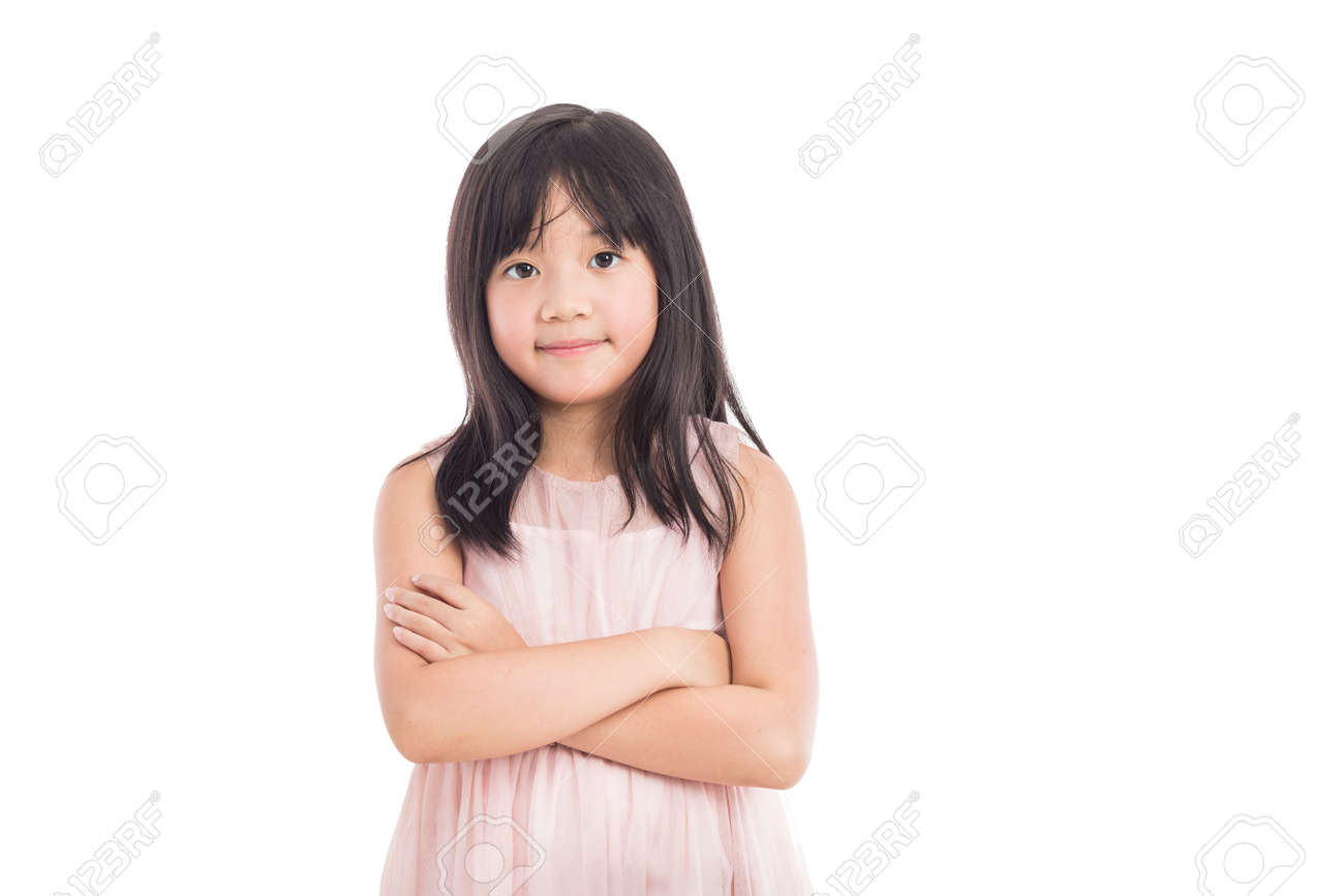 Portrait Of A Little Asian Girl Standing With Folded Hands Over White Background Stock Photo Portrait Of A Little Asian Girl Standing With Folded Hands Over White Background Stock Photo
