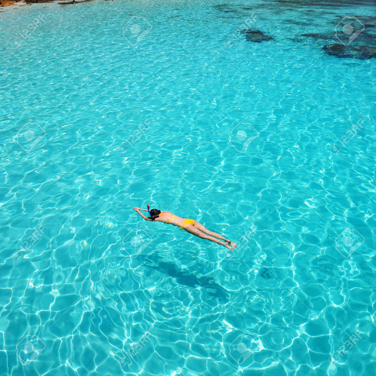 woman snorkeling in crystal