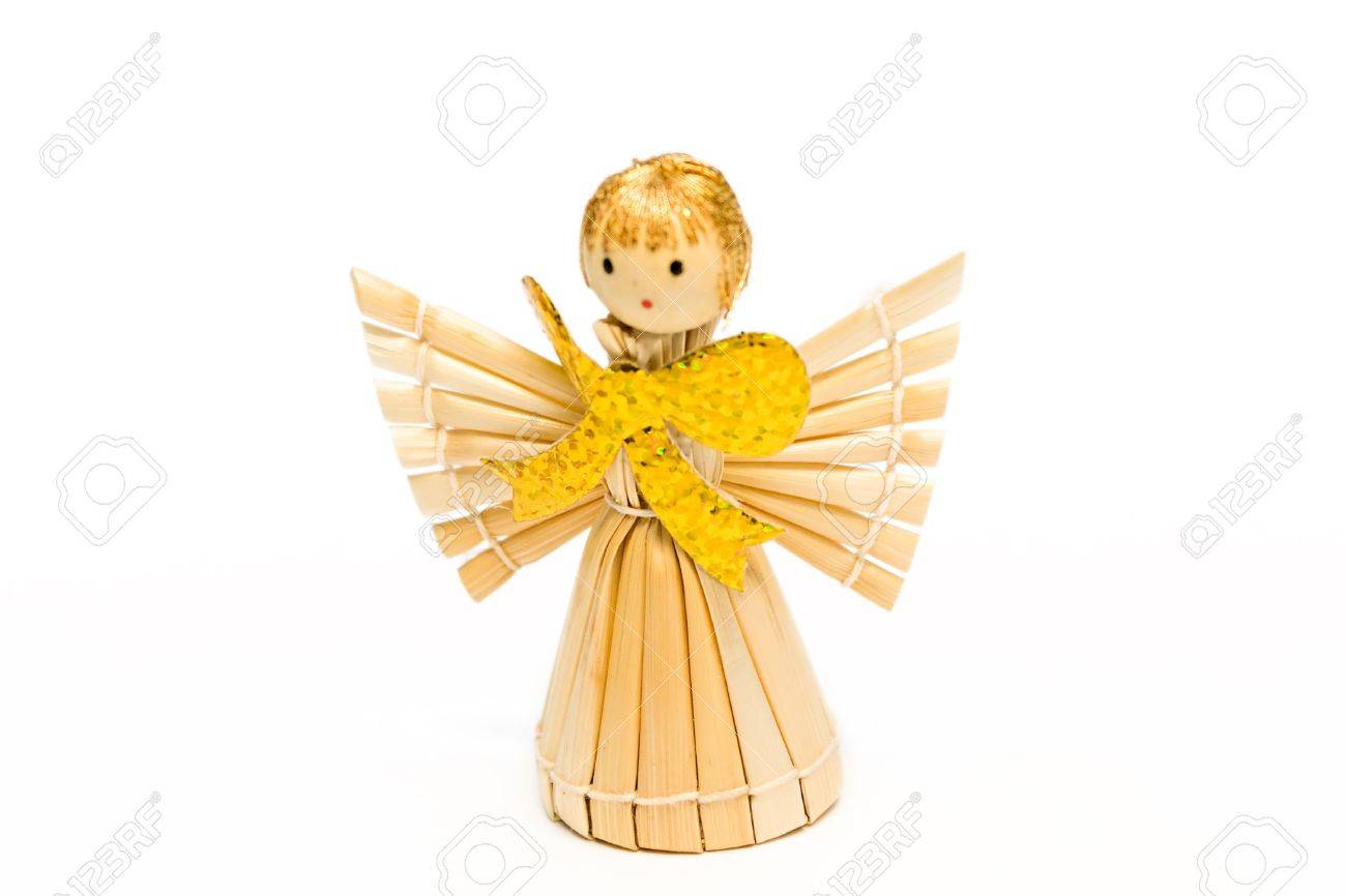 the angel made of straw with the big gold bow stock photo picture