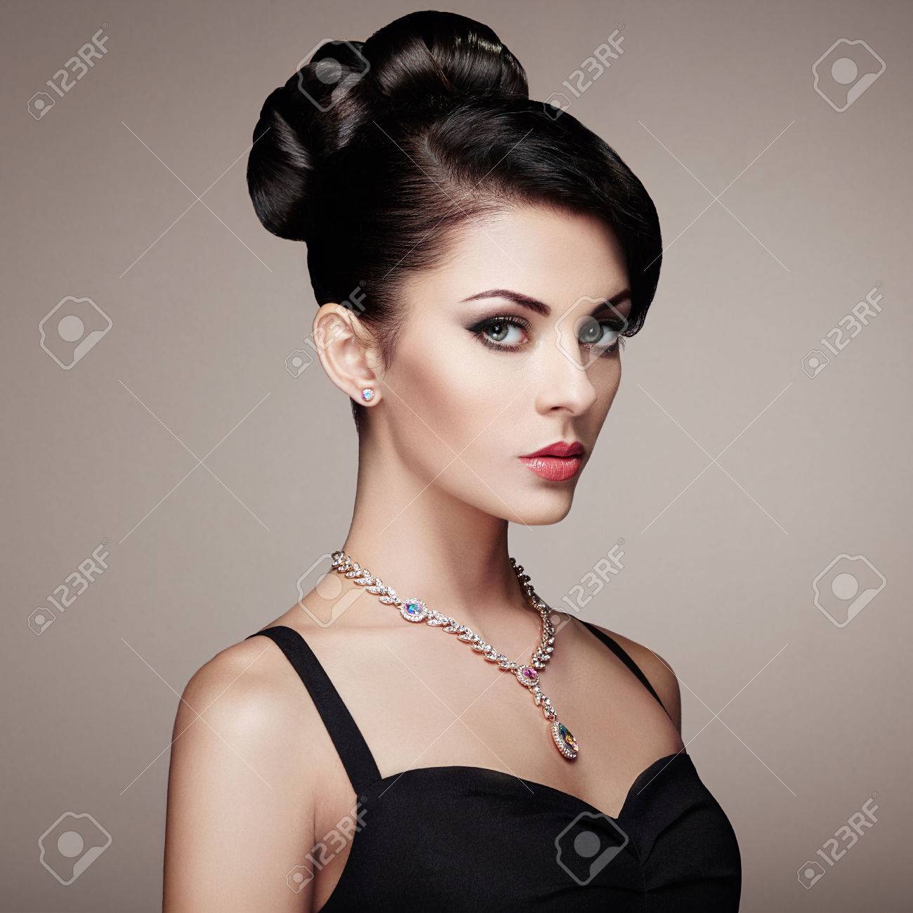 Fashion portrait of young beautiful woman with jewelry and elegant hairstyle. Brunette girl. Perfect make-up. Beauty style woman with diamond accessories - 62519857 Fashion portrait of young beautiful woman with jewelry and elegant hairstyle. Brunette girl. Perfect make-up. Beauty style woman with diamond accessories - 62519857